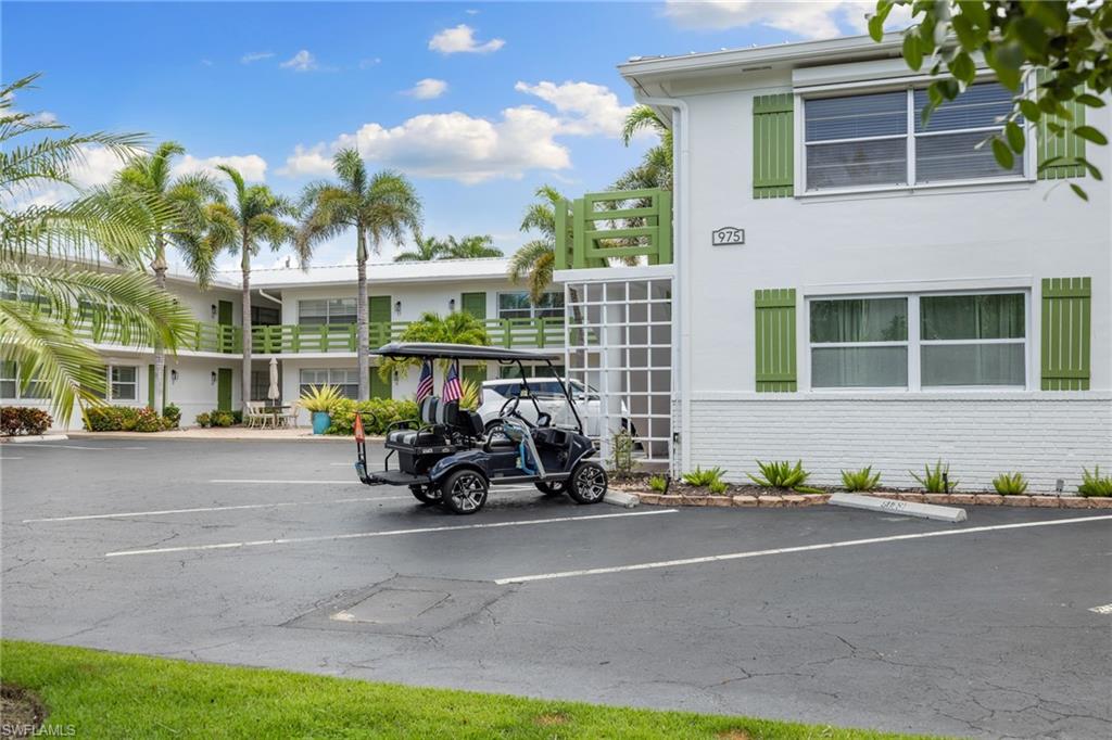 975 9th Avenue South, Unit 19 Naples, FL 34102 - Photo 16 of 19 a bike parked in front of a house