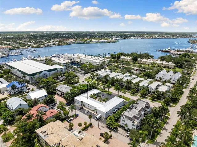 an aerial view of a house with a lake view