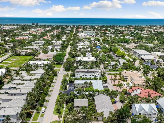 an aerial view of residential building with parking space