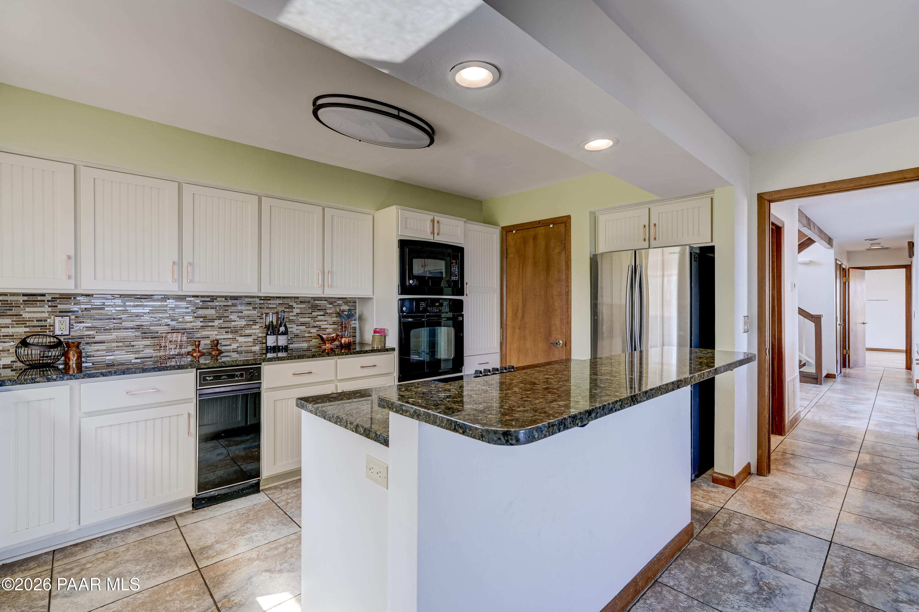 2480 Ridge Road Prescott, AZ 86301 - Photo 12 of 66 a kitchen with stainless steel appliances granite countertop a refrigerator a stove and a sink