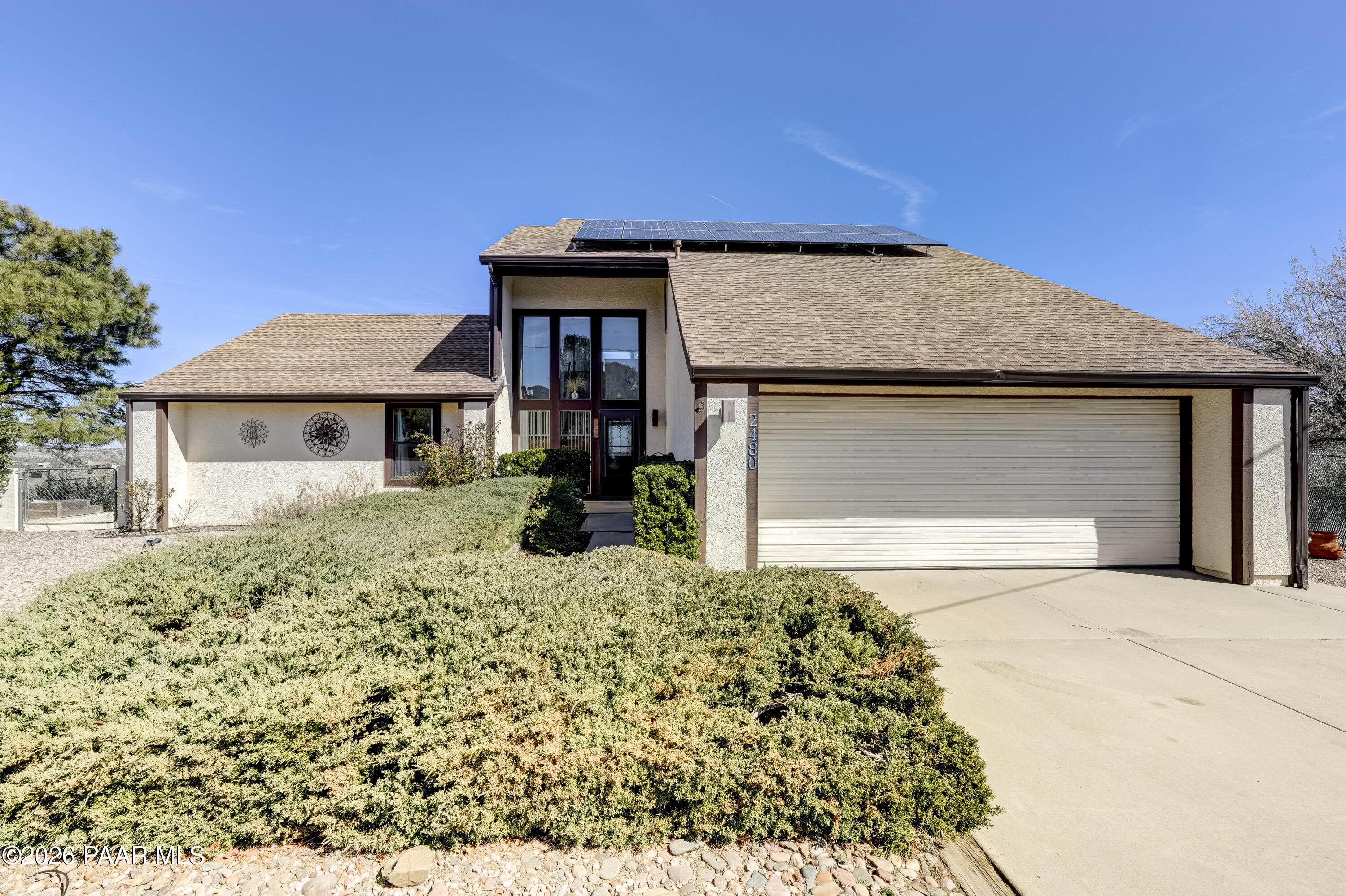 2480 Ridge Road Prescott, AZ 86301 - Photo 2 of 66 a front view of a house with a yard