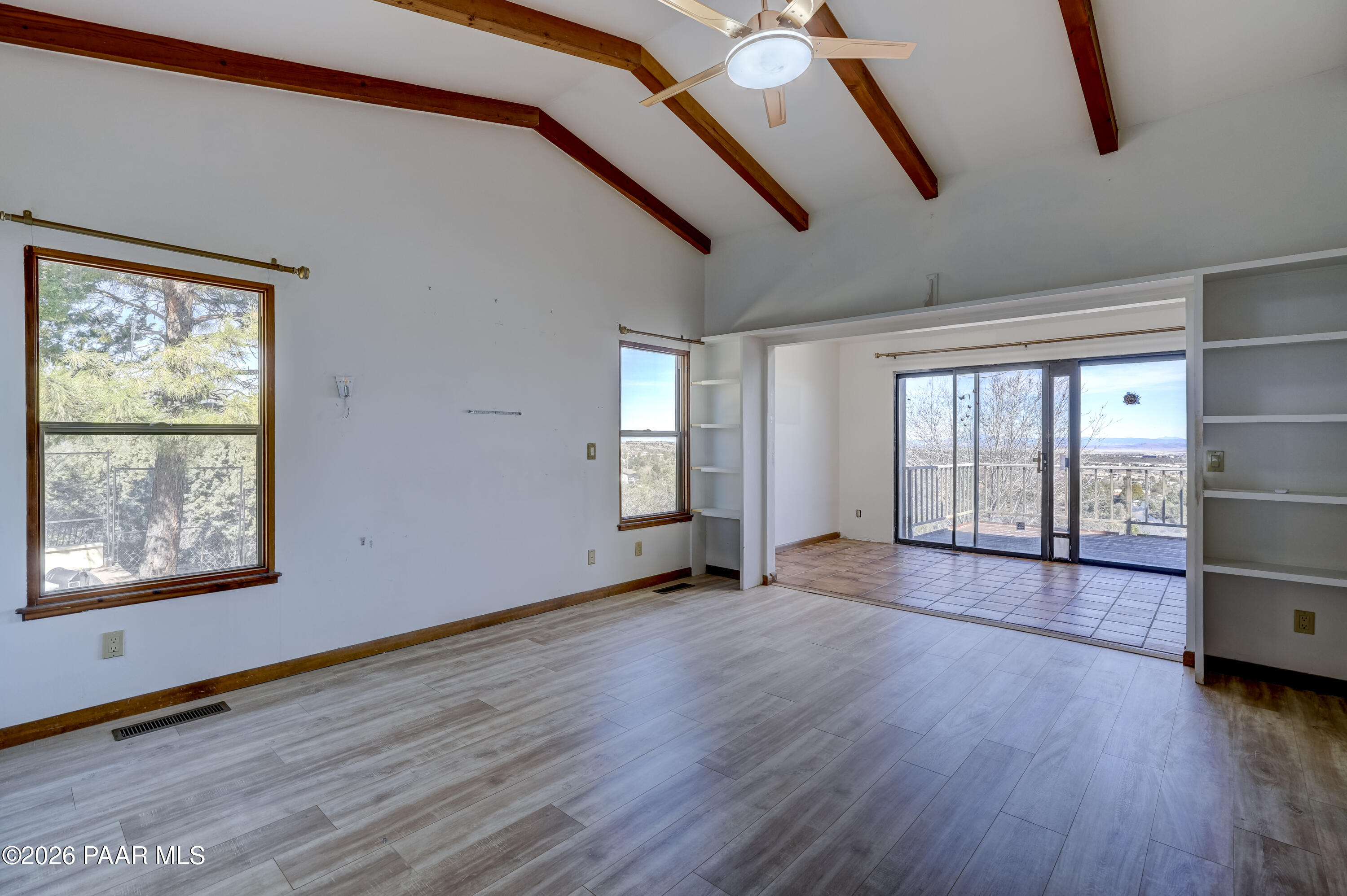 2480 Ridge Road Prescott, AZ 86301 - Photo 22 of 66 a view of an empty room with wooden floor and a window