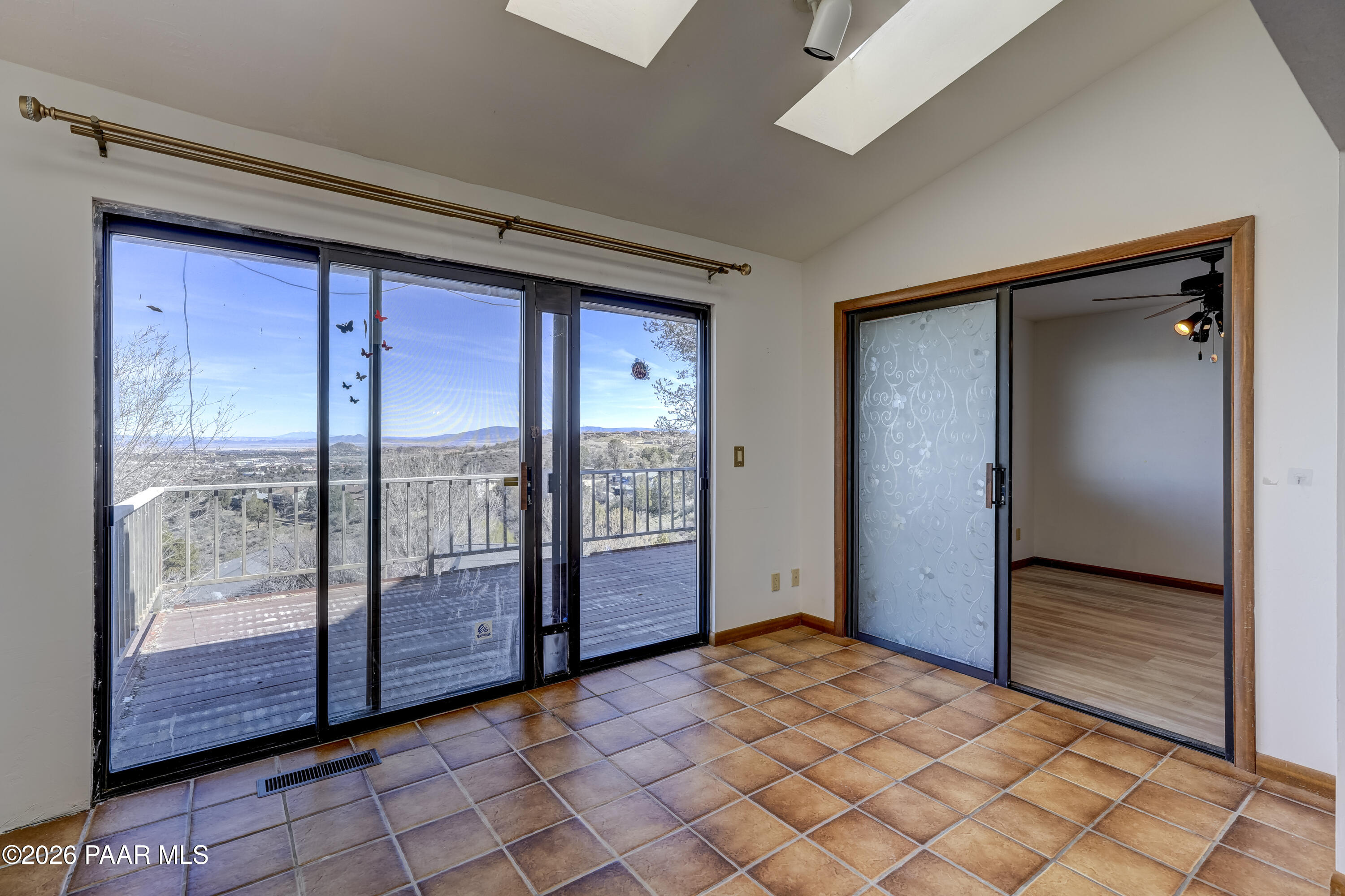2480 Ridge Road Prescott, AZ 86301 - Photo 24 of 66 a view of a hallway with wooden floor and sliding glass door