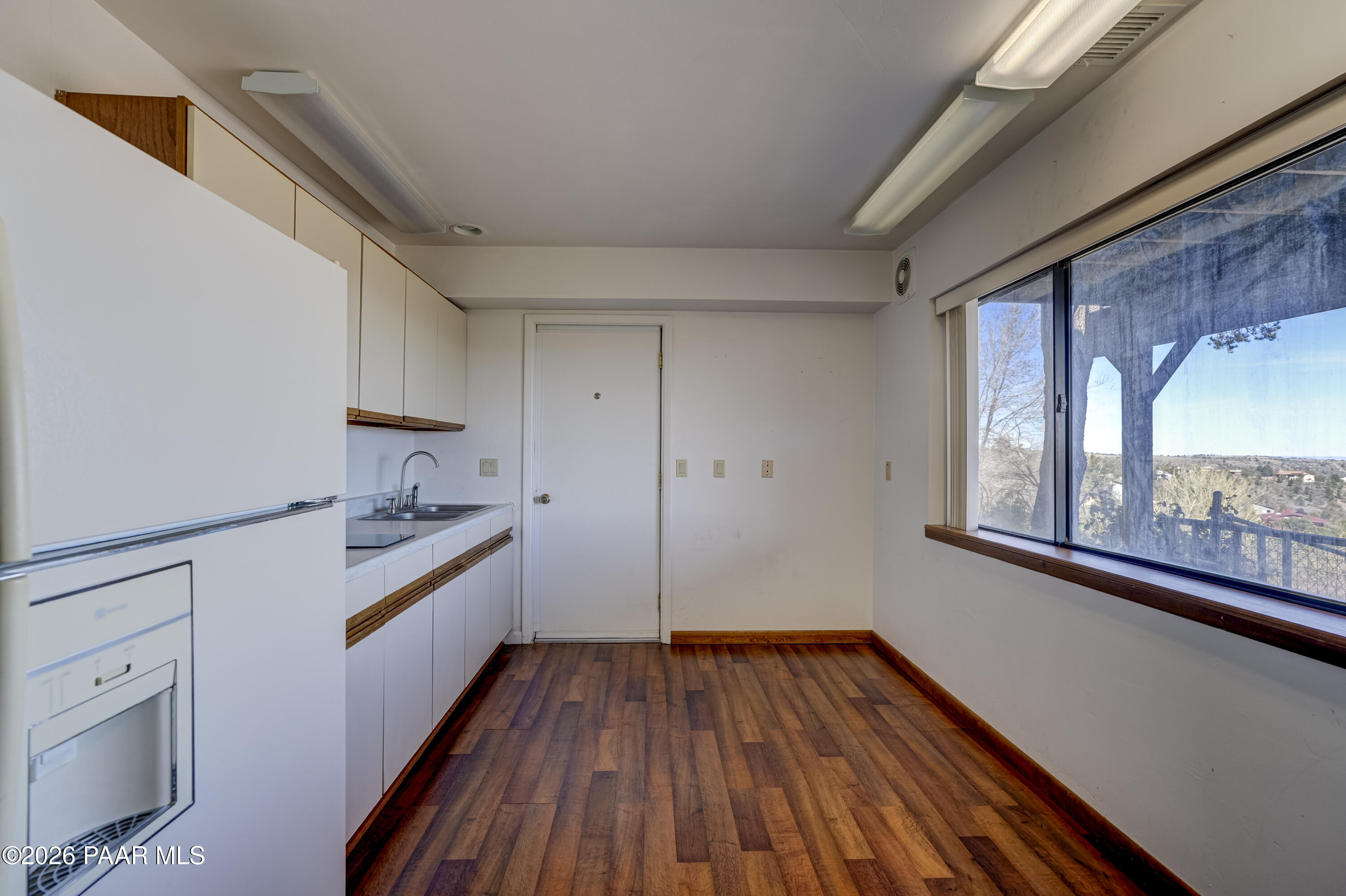 2480 Ridge Road Prescott, AZ 86301 - Photo 35 of 66 a view of a kitchen with wooden floor and electronic appliances