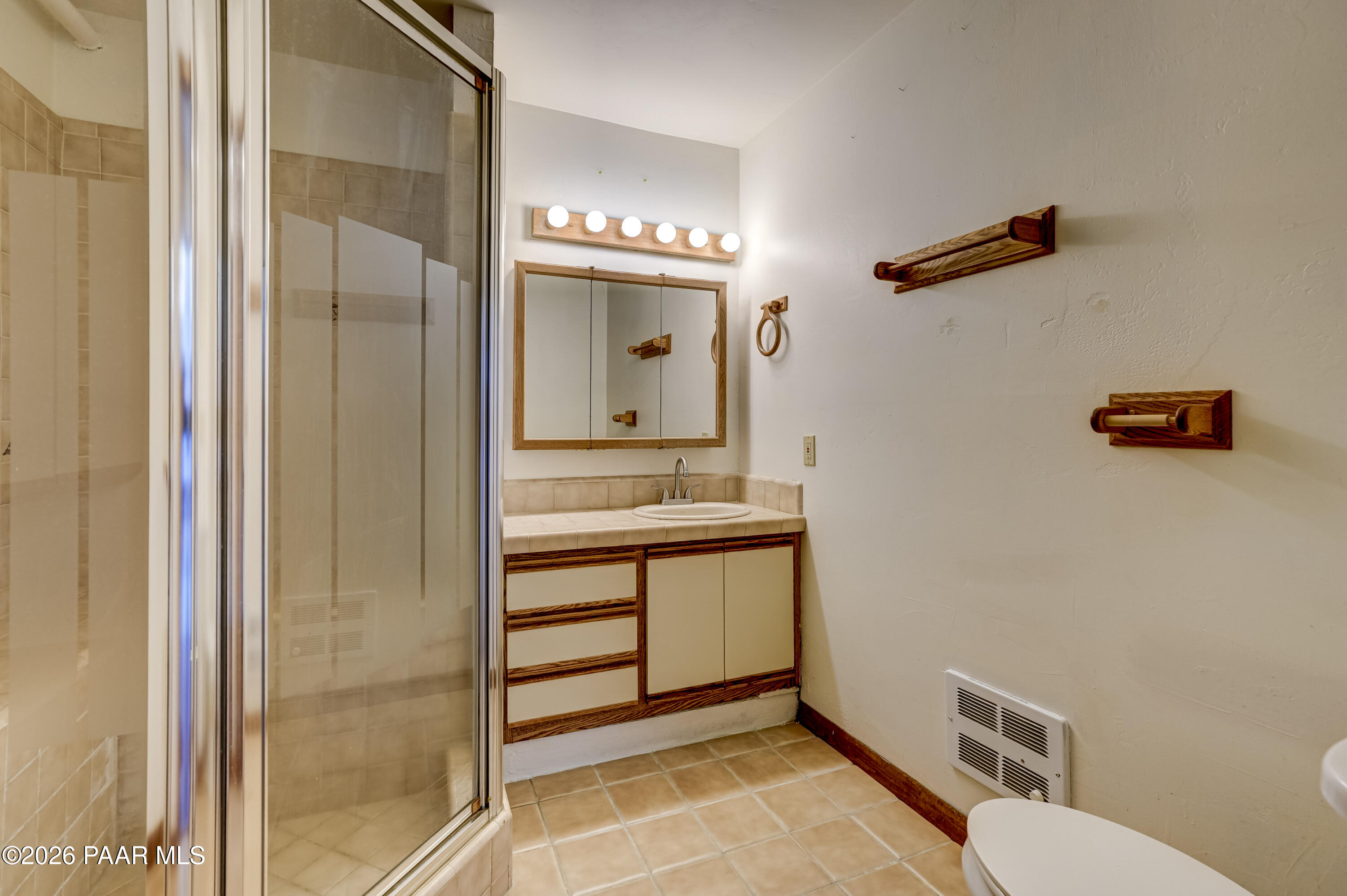 2480 Ridge Road Prescott, AZ 86301 - Photo 36 of 66 a bathroom with a sink a toilet and a mirror