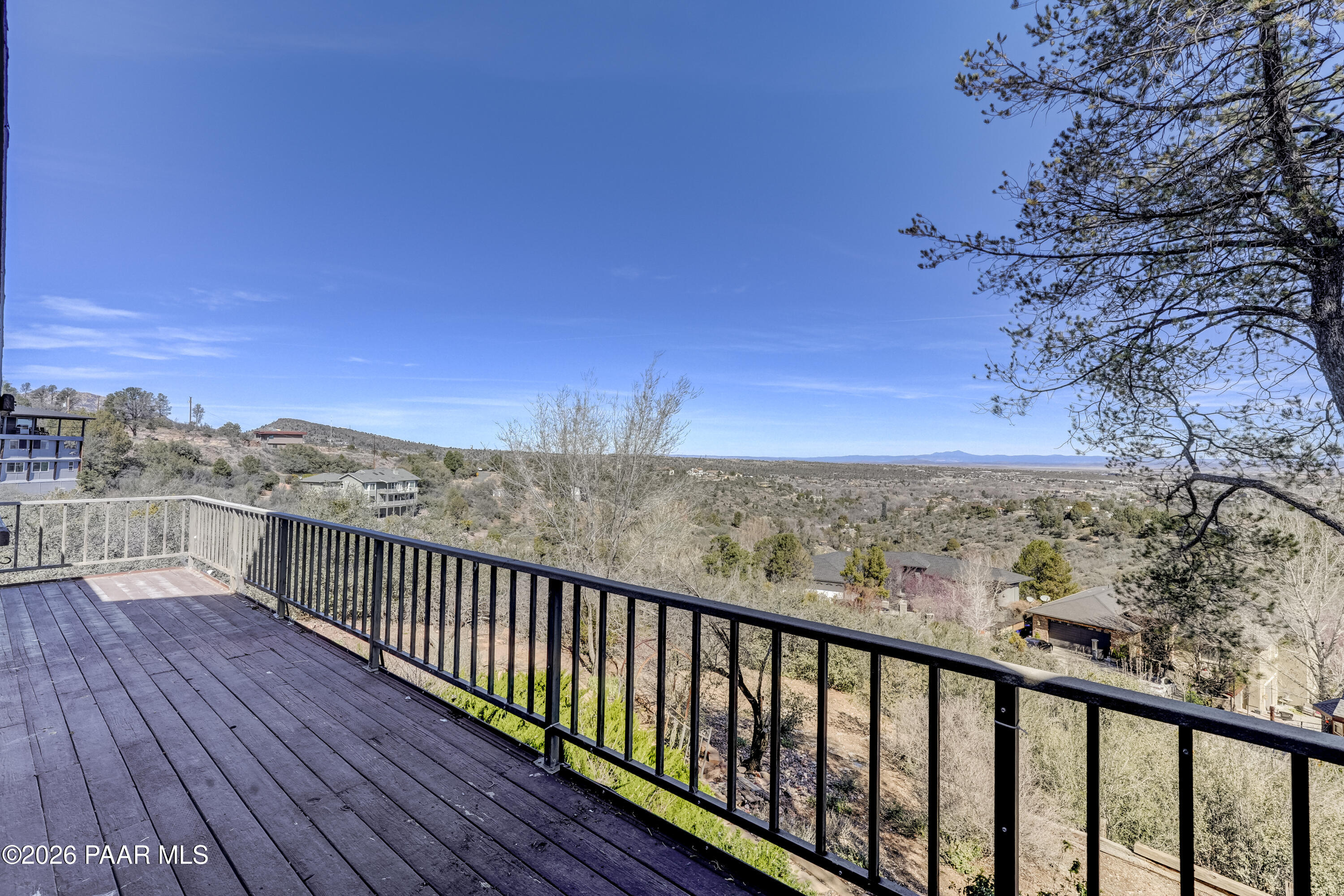 2480 Ridge Road Prescott, AZ 86301 - Photo 47 of 66 a view of a balcony with wooden floor and fence