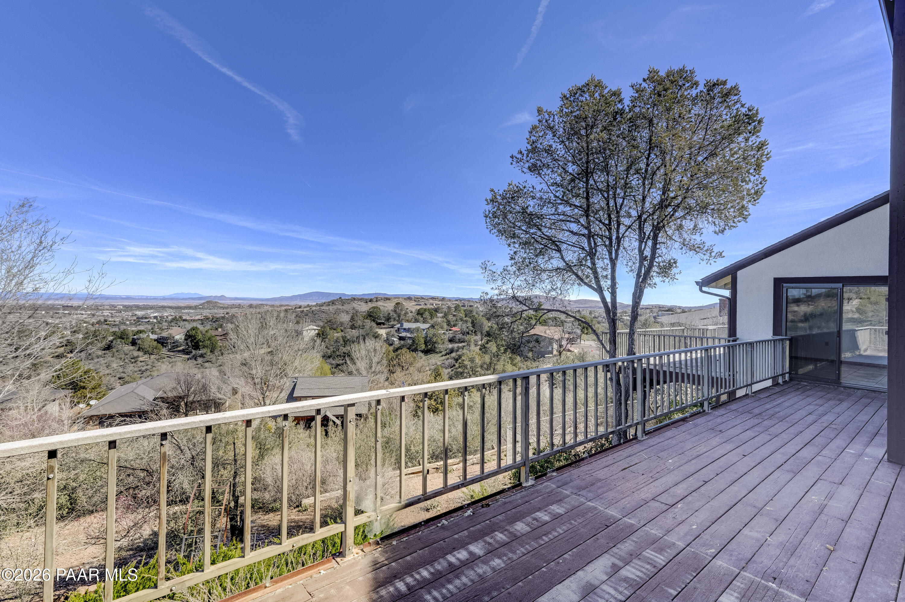 2480 Ridge Road Prescott, AZ 86301 - Photo 48 of 66 a view of a balcony with wooden fence and floor