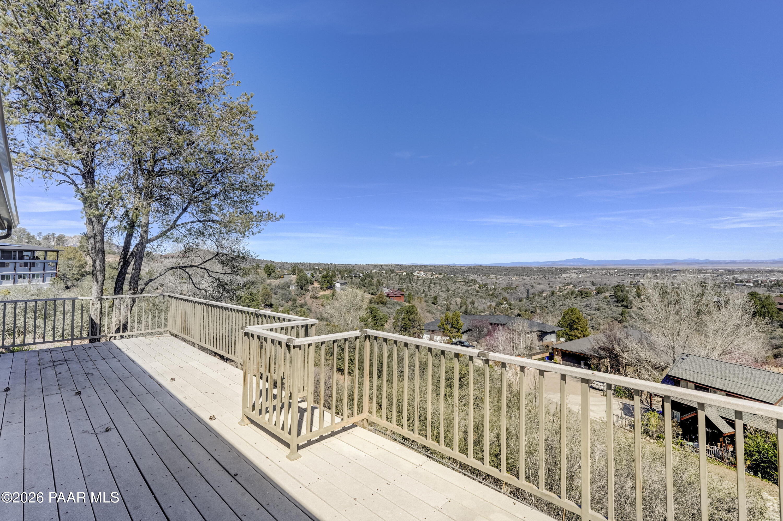 2480 Ridge Road Prescott, AZ 86301 - Photo 50 of 66 a view of a balcony with wooden floor and fence