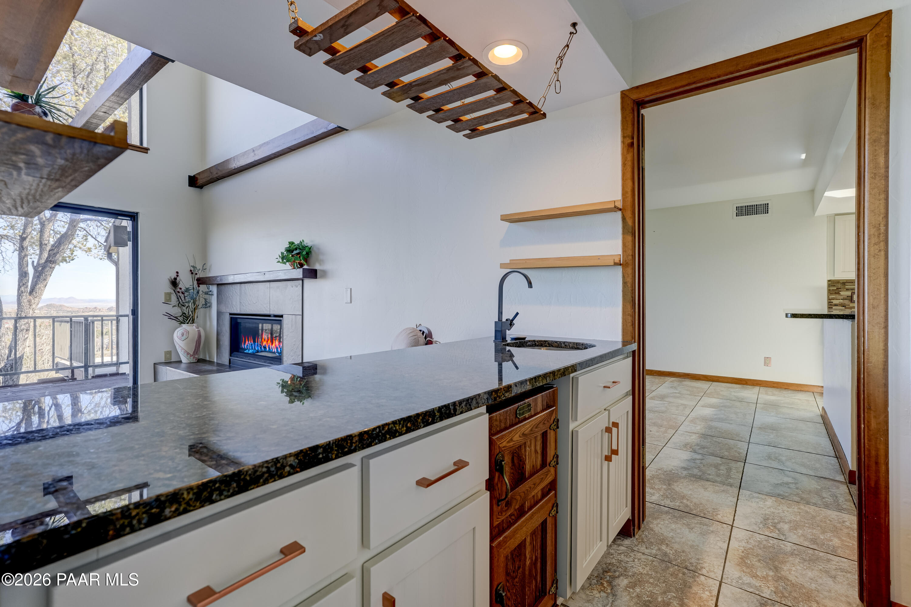 2480 Ridge Road Prescott, AZ 86301 - Photo 8 of 66 a kitchen with granite countertop a sink and a stove top oven