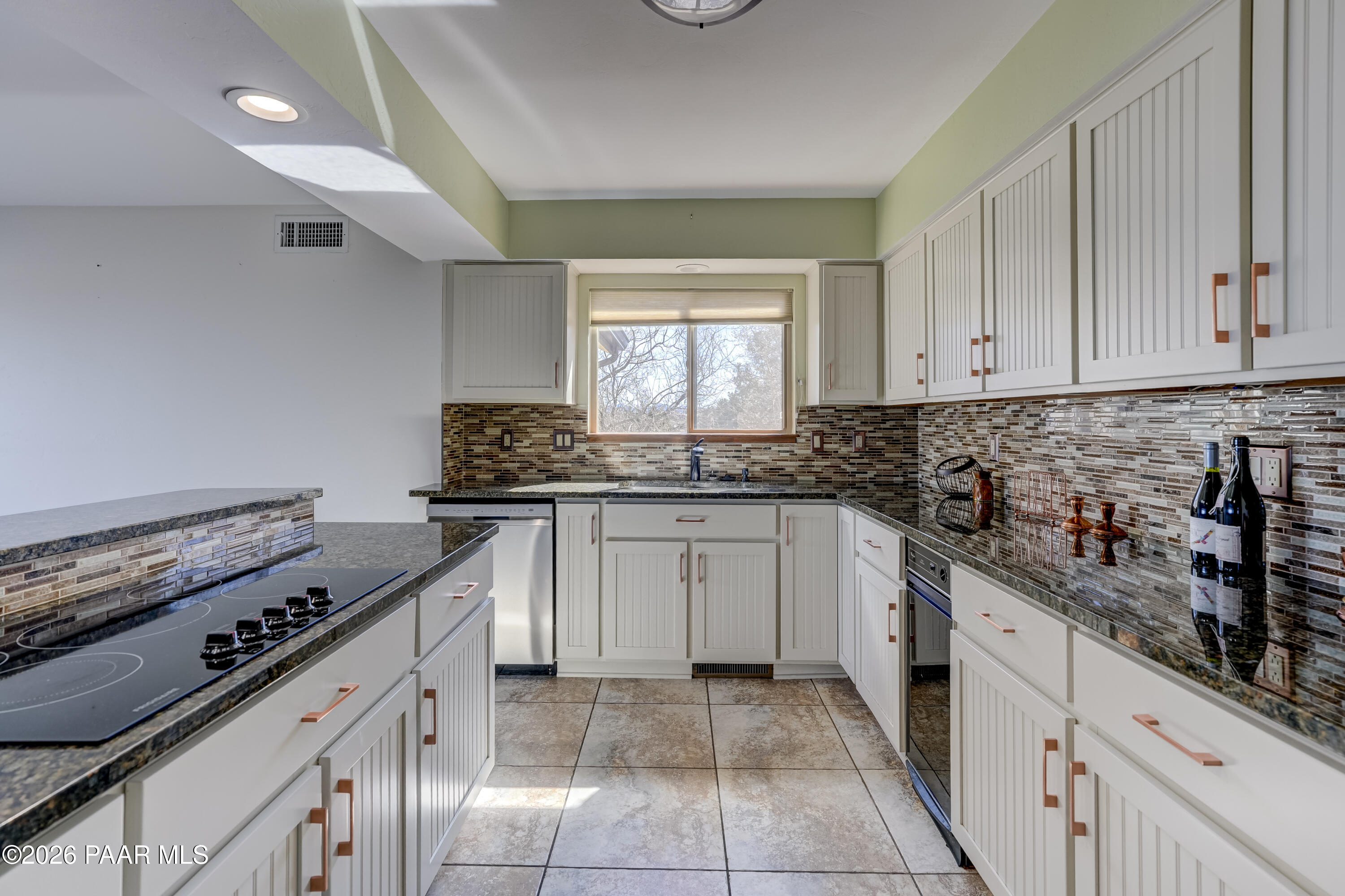 2480 Ridge Road Prescott, AZ 86301 - Photo 9 of 66 a kitchen with granite countertop a stove sink and cabinets
