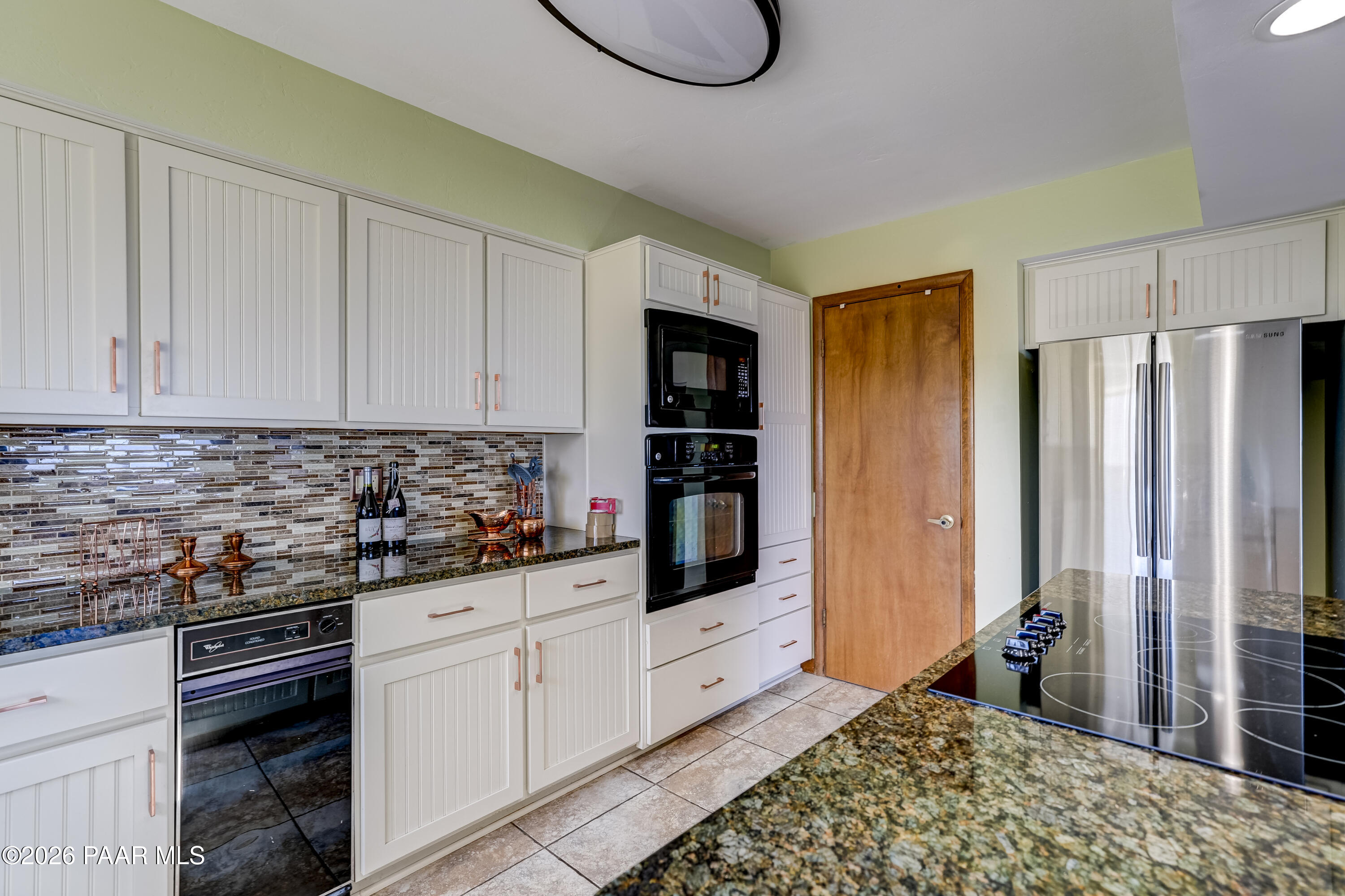 2480 Ridge Road Prescott, AZ 86301 - Photo 10 of 66 a kitchen with stainless steel appliances a refrigerator sink and cabinets