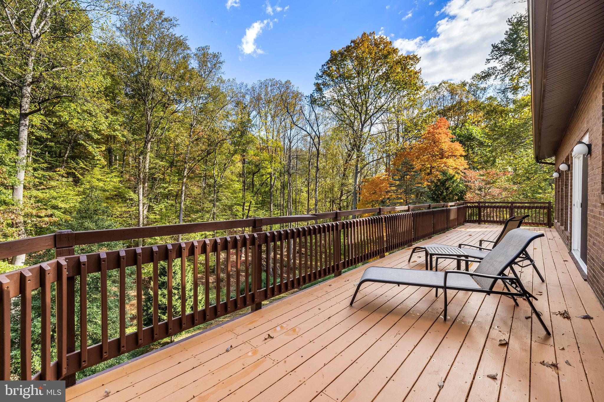 1106 High Country Road Towson, MD 21286 - Photo 20 of 77 a view of a balcony with wooden floor and fence