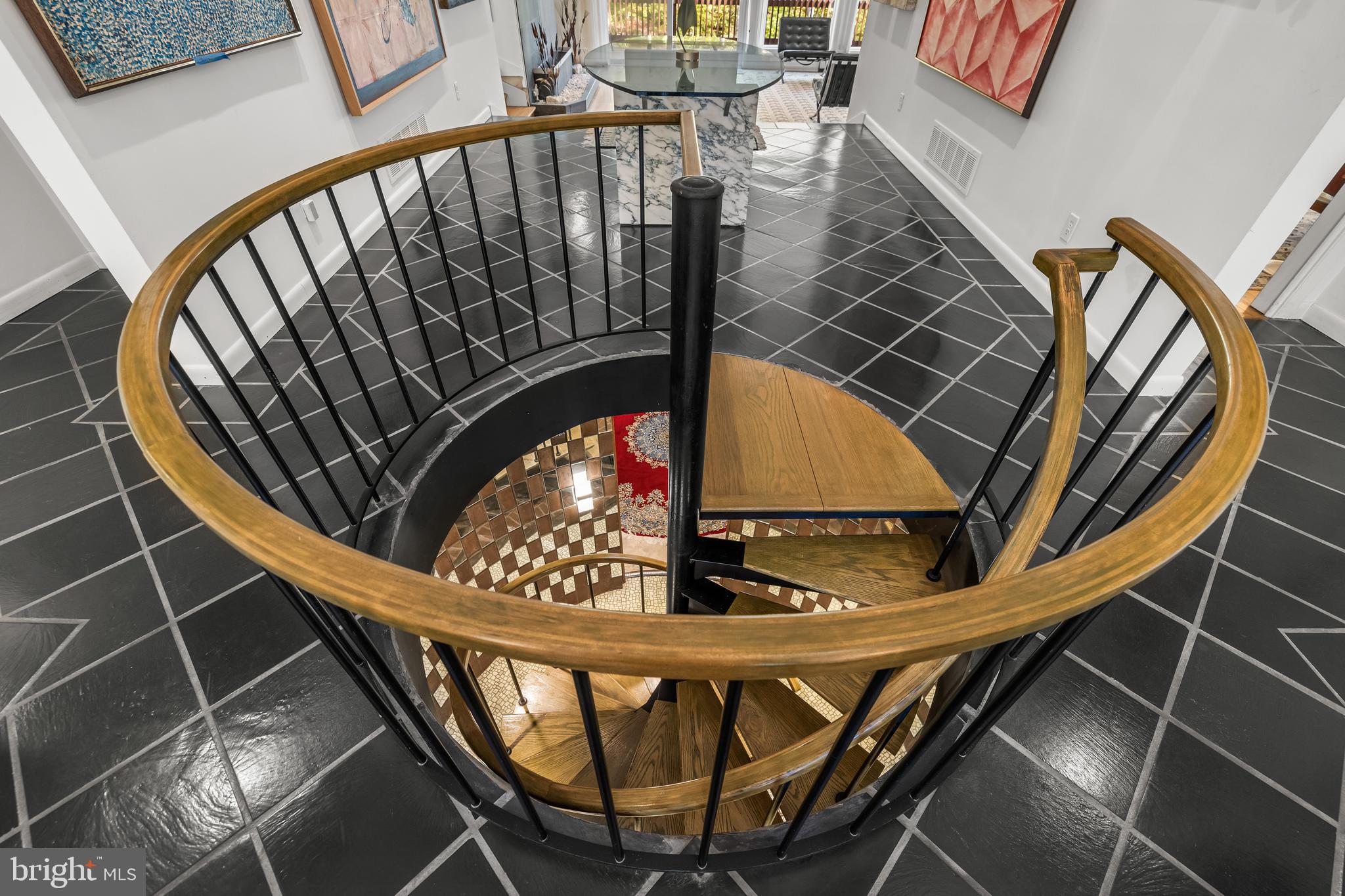 1106 High Country Road Towson, MD 21286 - Photo 29 of 77 Circular staircase to lower level