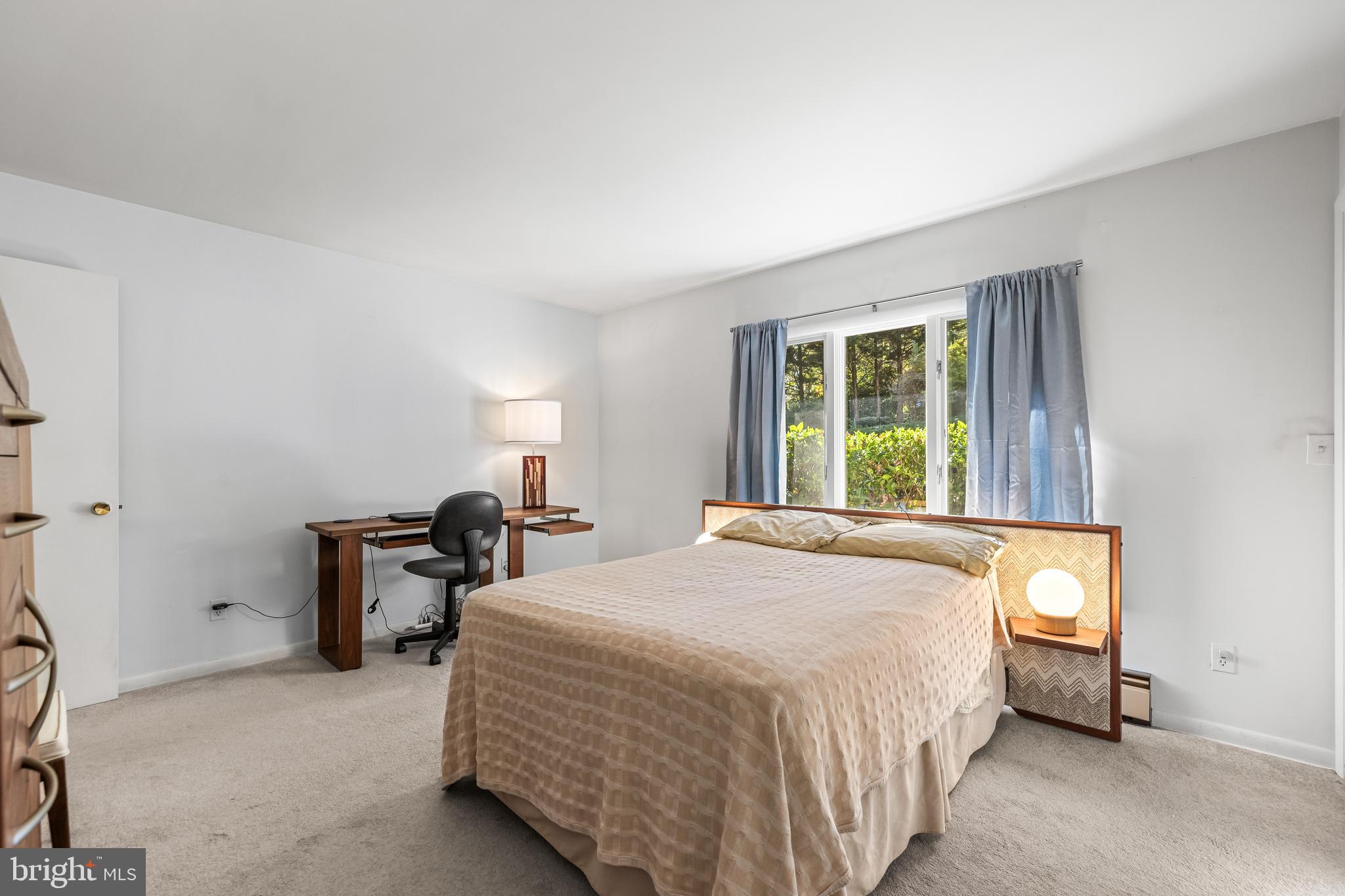 1106 High Country Road Towson, MD 21286 - Photo 32 of 77 a bedroom with a bed and a window