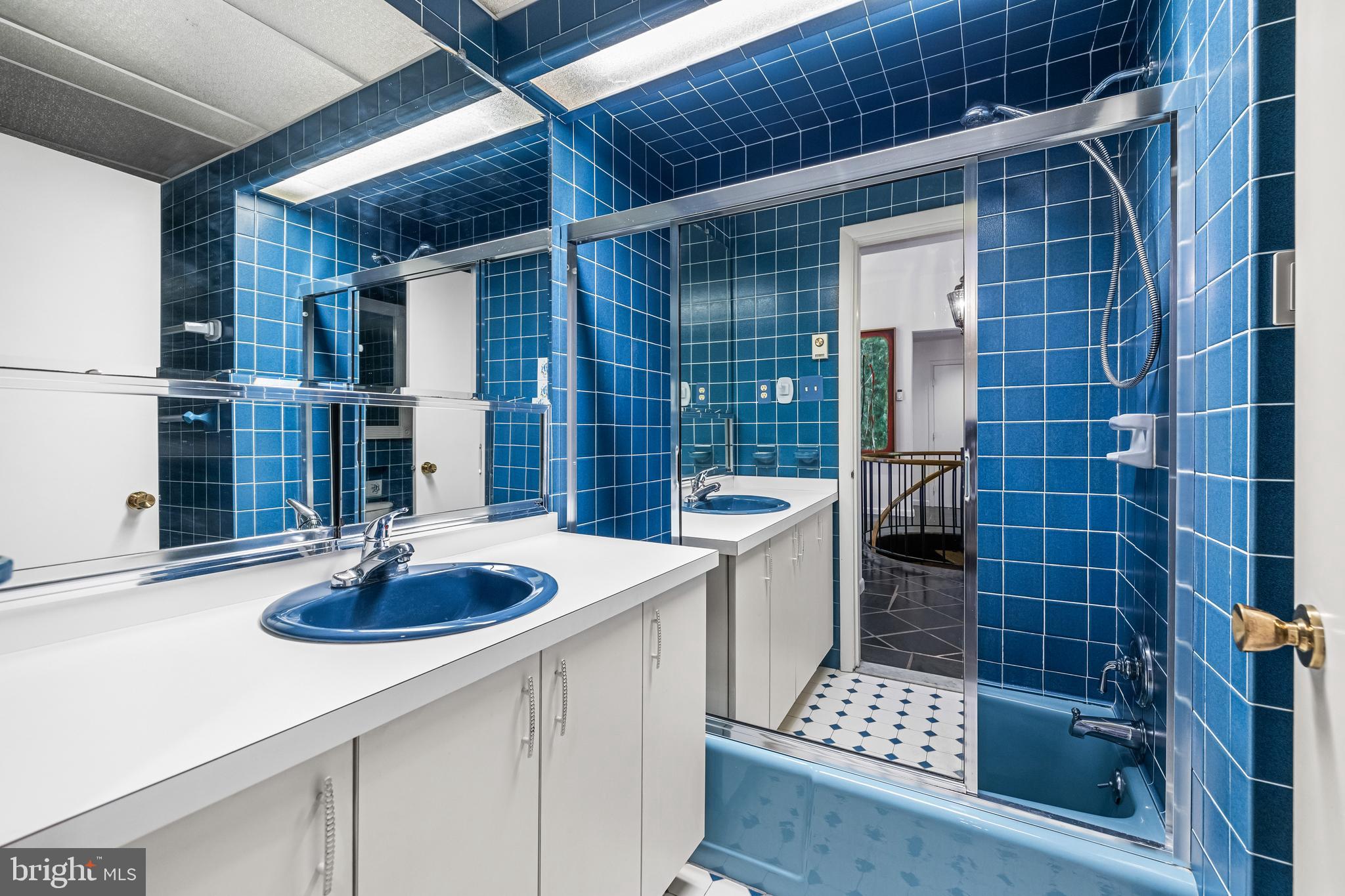 1106 High Country Road Towson, MD 21286 - Photo 33 of 77 a kitchen with a sink and wooden cabinets