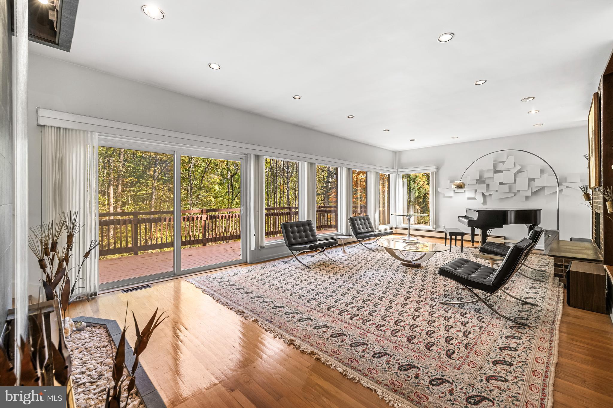 1106 High Country Road Towson, MD 21286 - Photo 39 of 77 a living room with furniture large window and a fireplace
