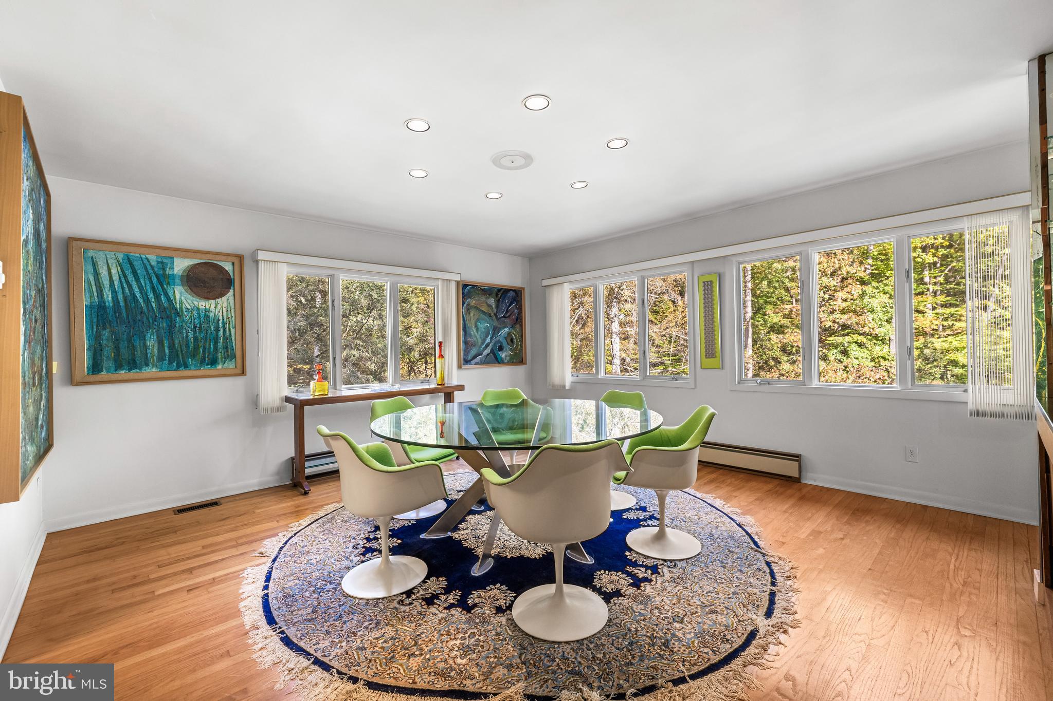 1106 High Country Road Towson, MD 21286 - Photo 41 of 77 a dining room with furniture a rug and wooden floor