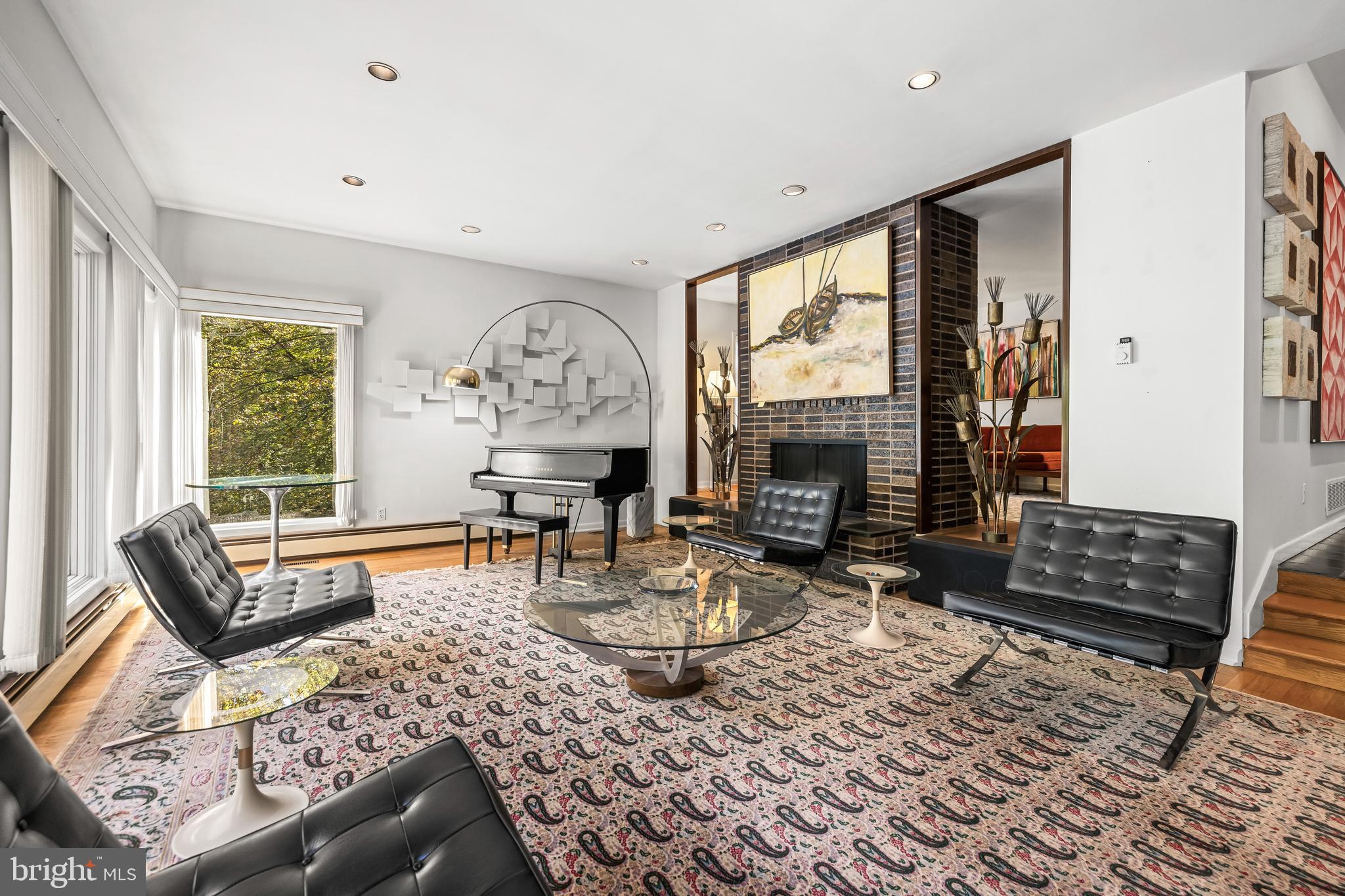 1106 High Country Road Towson, MD 21286 - Photo 44 of 77 a living room with furniture a fireplace and a table