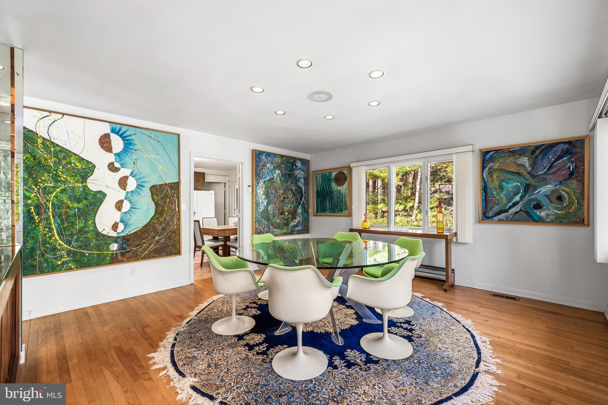 1106 High Country Road Towson, MD 21286 - Photo 48 of 77 a dining room with furniture a rug and wooden floor