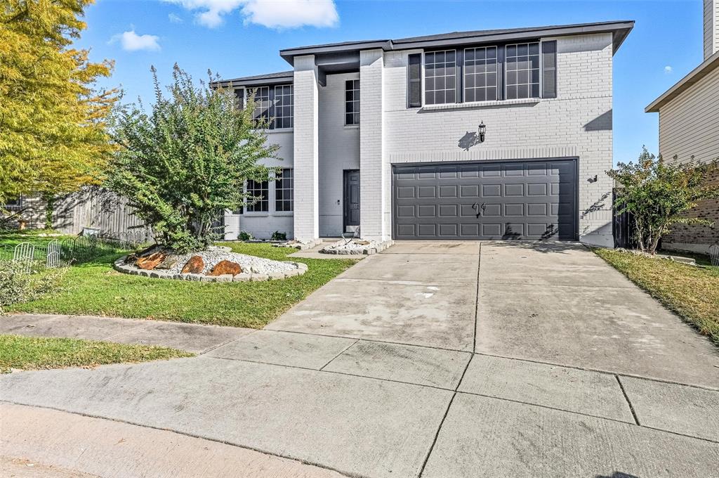 1130 Annie Oakley Drive Anna, TX 75409 - Photo 1 of 32 a front view of a house with a garden and plants