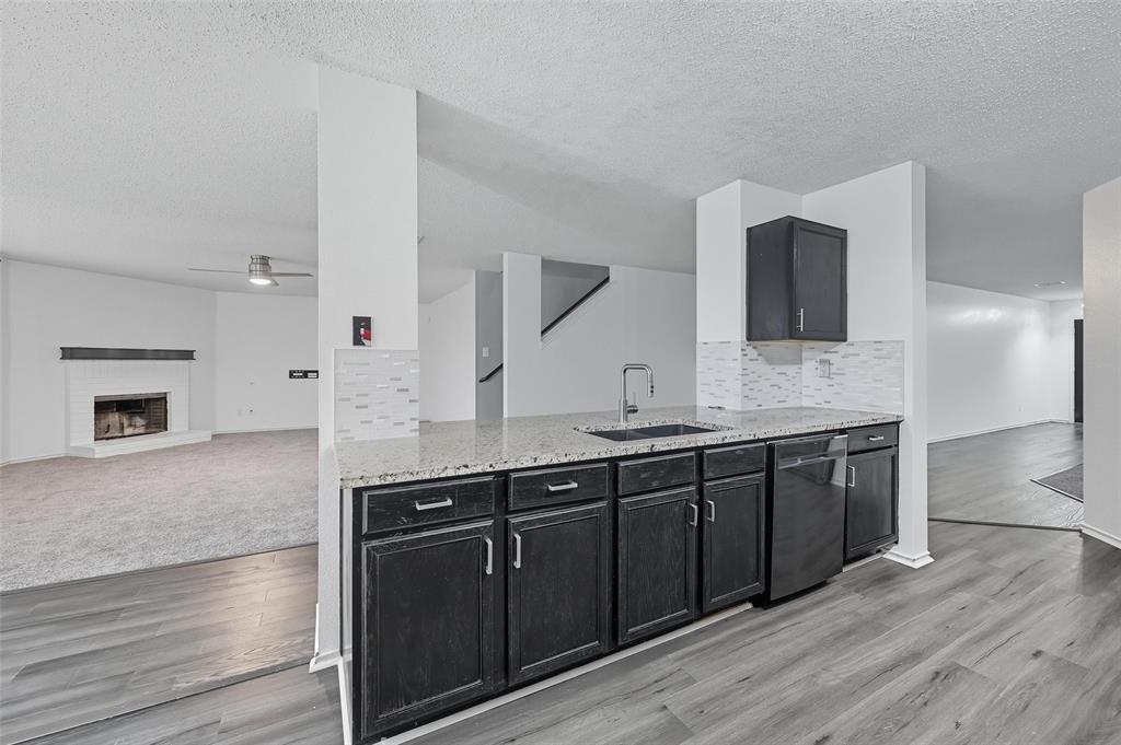1130 Annie Oakley Drive Anna, TX 75409 - Photo 31 of 32 a spacious bathroom with stainless steel appliances granite countertop a sink and a microwave