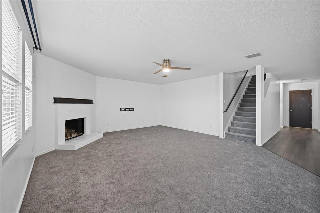 1130 Annie Oakley Drive Anna, TX 75409 - Photo 12 of 32 a view of a livingroom with a fireplace and window