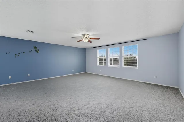 a view of a livingroom with a fireplace and window