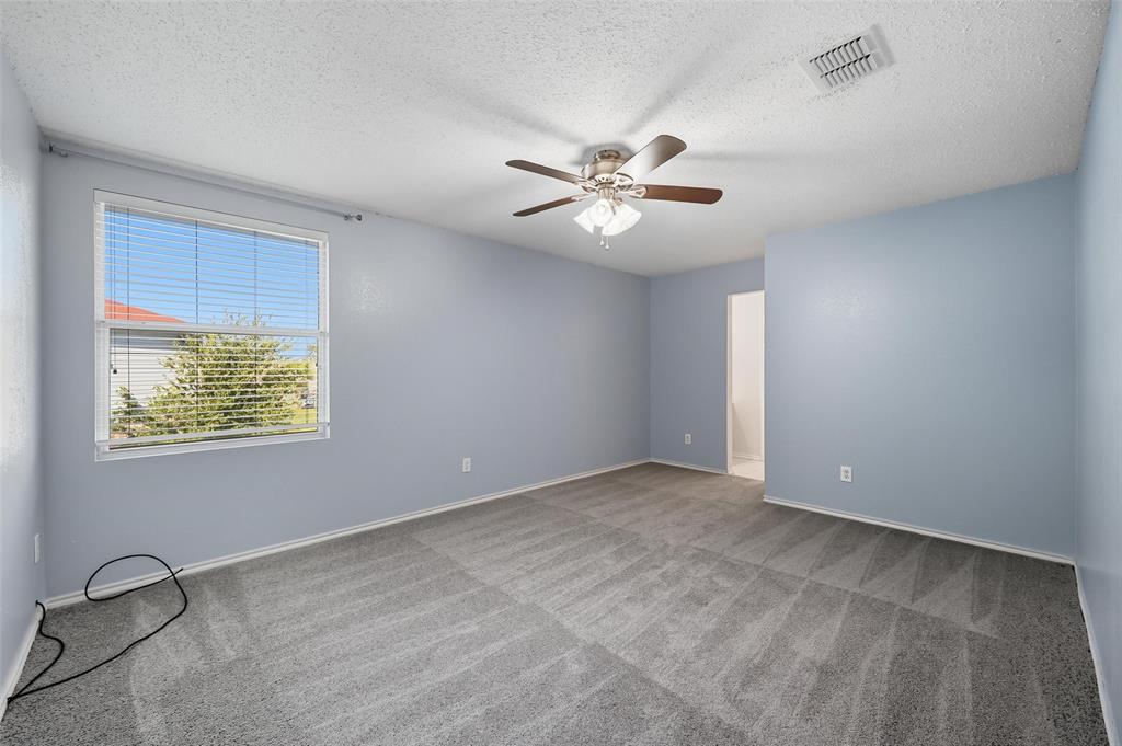 1130 Annie Oakley Drive Anna, TX 75409 - Photo 18 of 32 a view of an empty room with a window