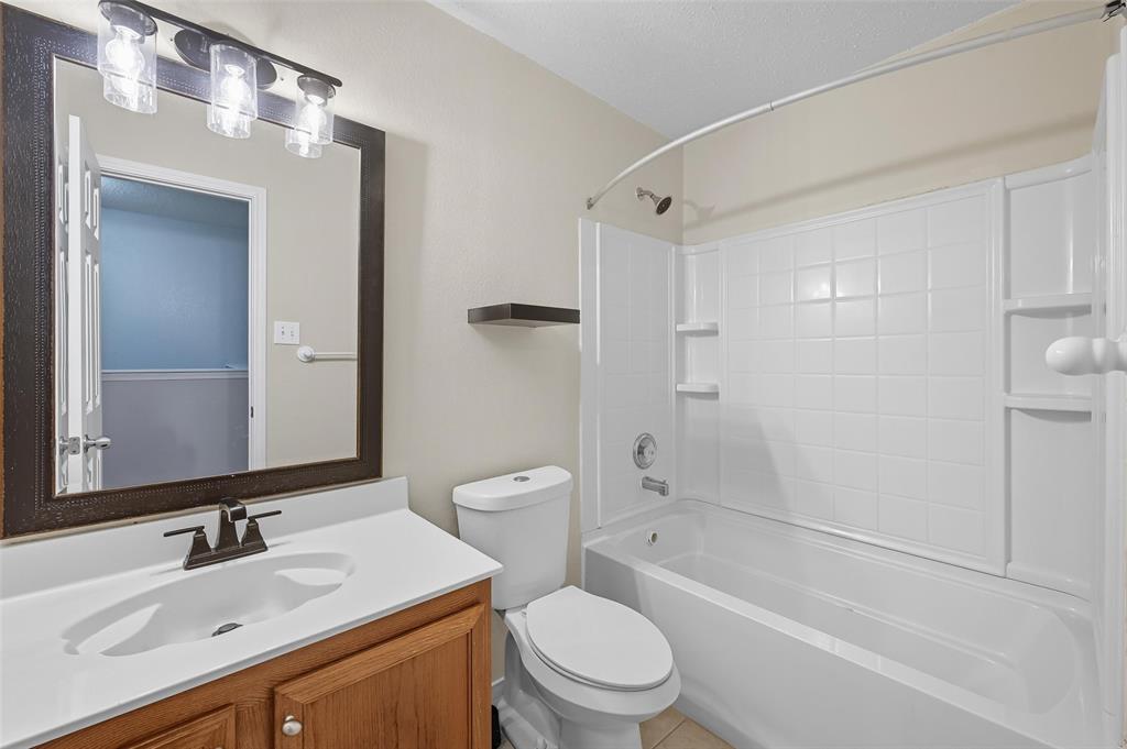 1130 Annie Oakley Drive Anna, TX 75409 - Photo 24 of 32 a bathroom with a sink toilet tub and shower