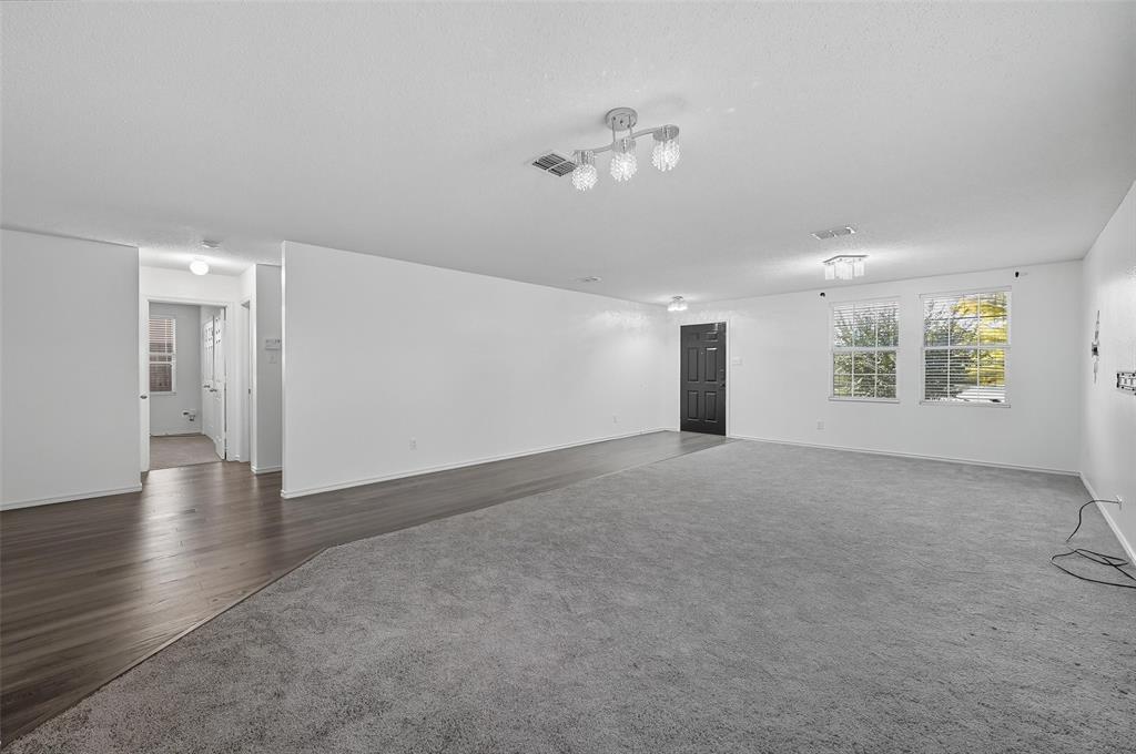 1130 Annie Oakley Drive Anna, TX 75409 - Photo 6 of 32 a view of an empty room with a window