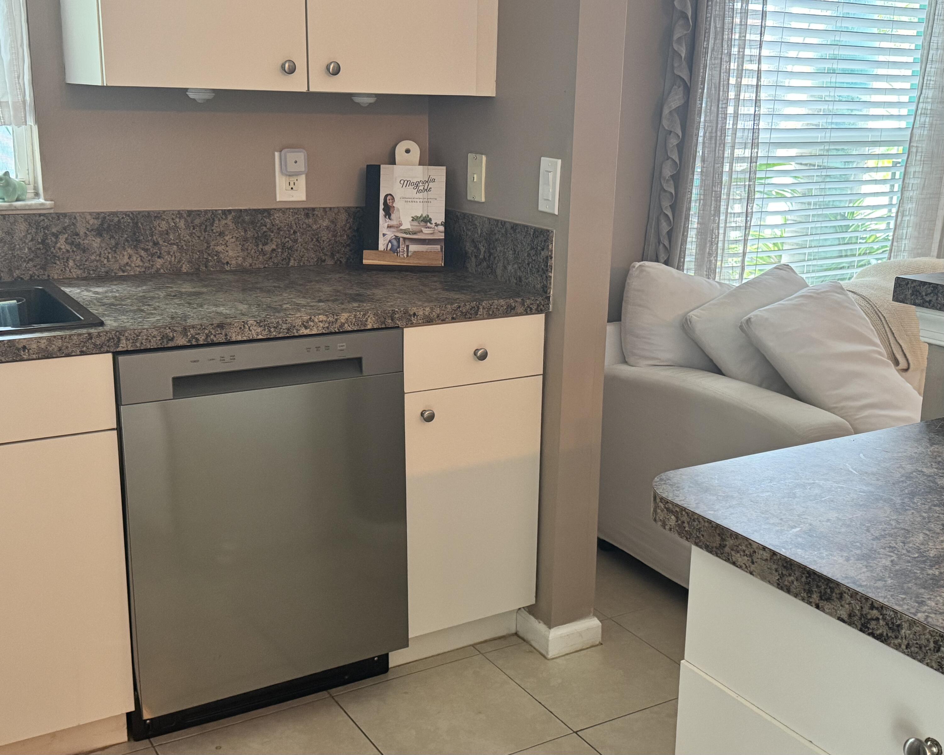 4571 Southeast Murray Cove Circle Stuart, FL 34997 - Photo 18 of 35 a kitchen with stainless steel appliances granite countertop a sink stove and refrigerator