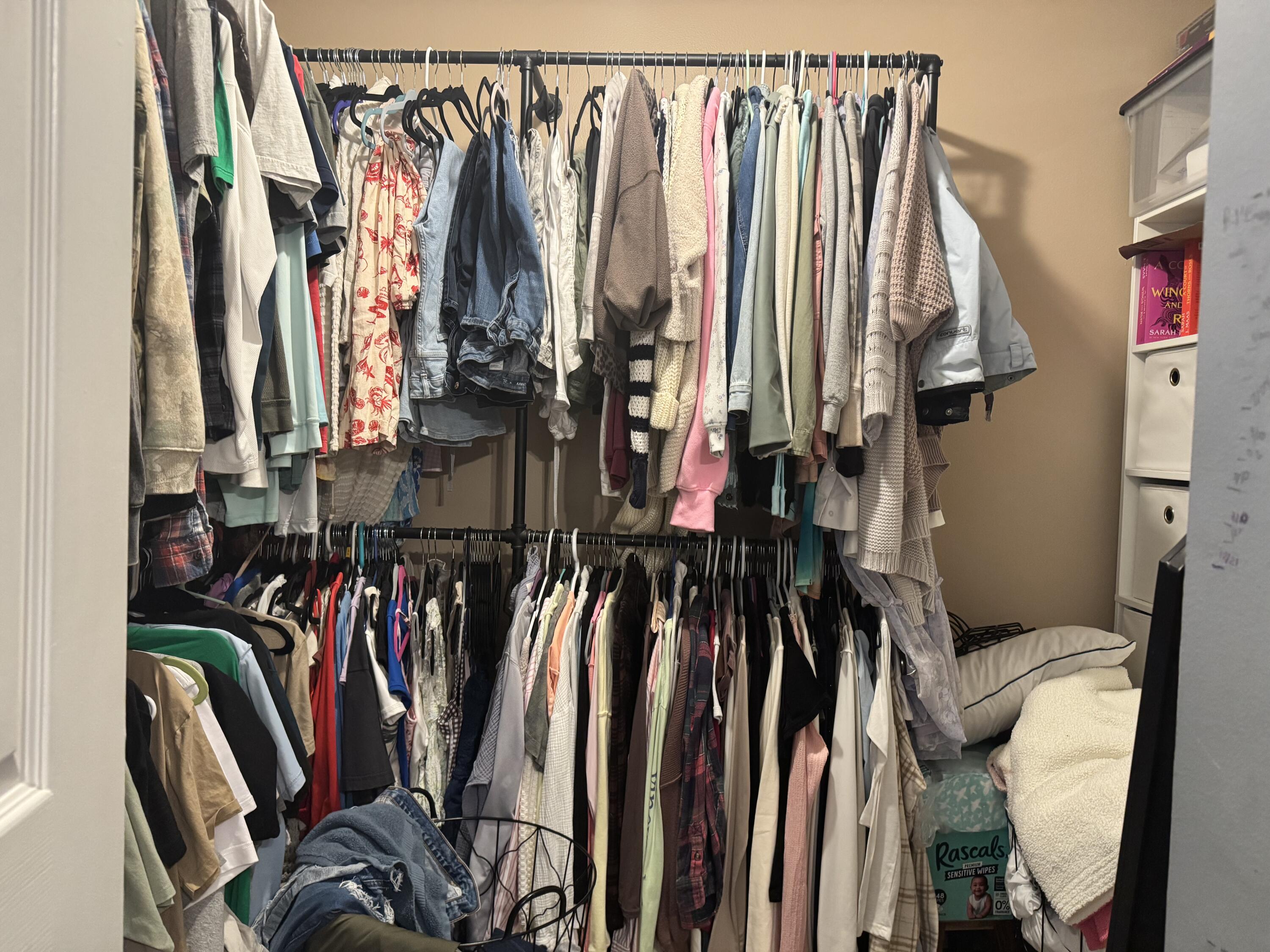4571 Southeast Murray Cove Circle Stuart, FL 34997 - Photo 24 of 35 a view of walk in closet with clothes