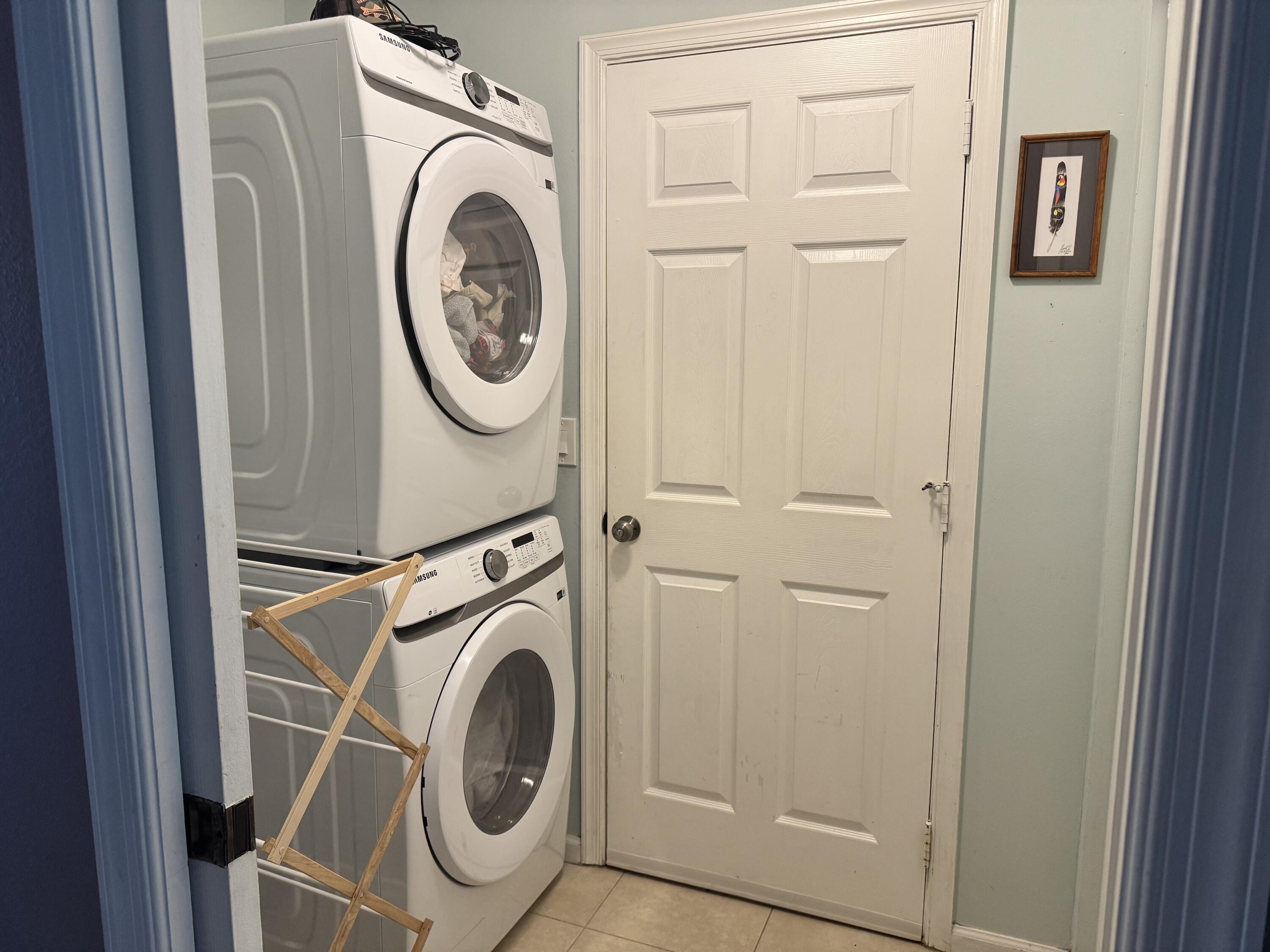 4571 Southeast Murray Cove Circle Stuart, FL 34997 - Photo 34 of 35 a utility room with dryer and washer