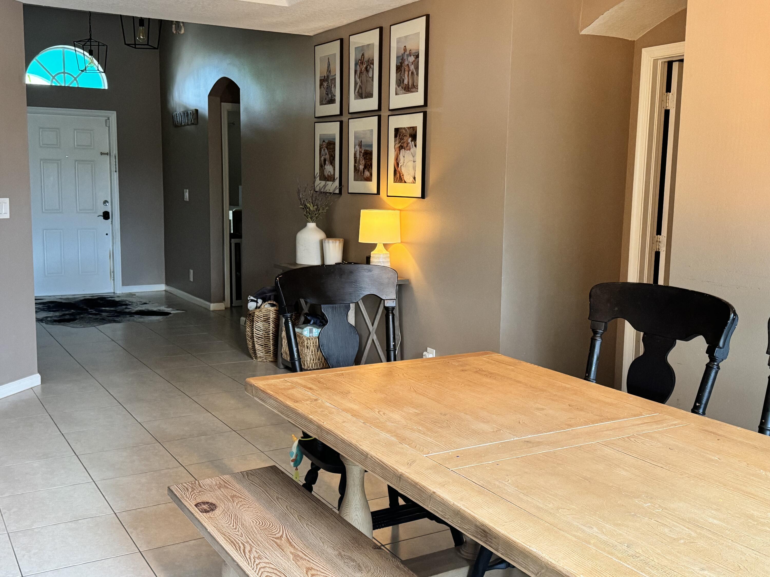 4571 Southeast Murray Cove Circle Stuart, FL 34997 - Photo 10 of 35 a dining room with a table and chairs