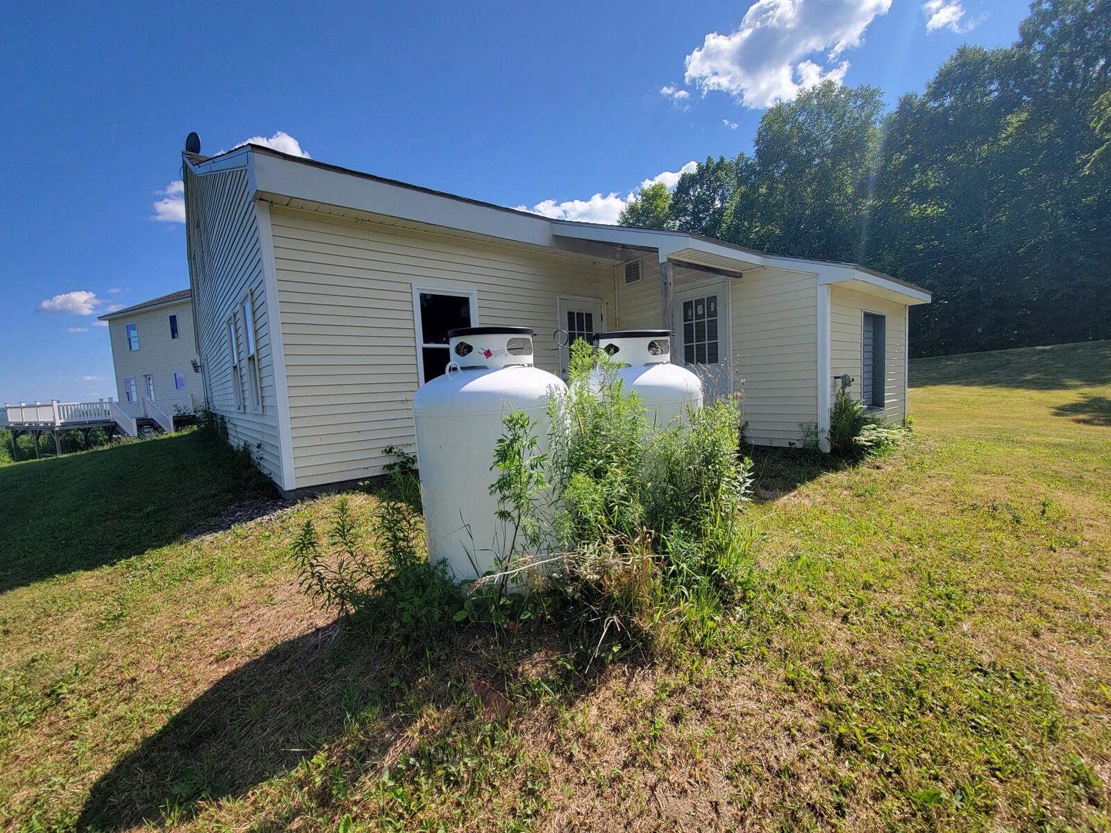 171 Magrath Road Wilton, ME 04294 - Photo 26 of 54 24-Generator tanks