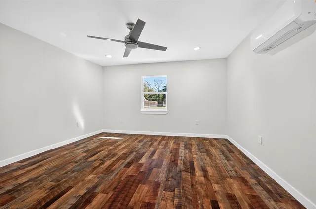 a view of a room with a ceiling fan
