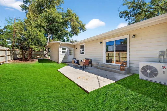 a view of outdoor space with garden and patio