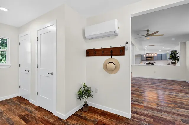 a view of a livingroom with furniture and wooden floor