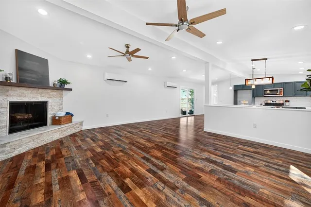 a view of a kitchen with furniture and a fireplace
