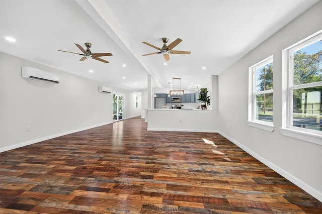a view of a kitchen with a sink and a window