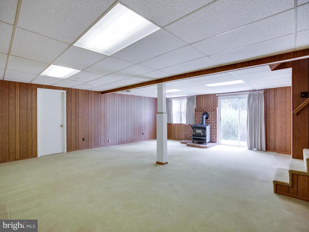 301 Plum Point Road Huntingtown, MD 20639 - Photo 14 of 17 Basement with wood stove