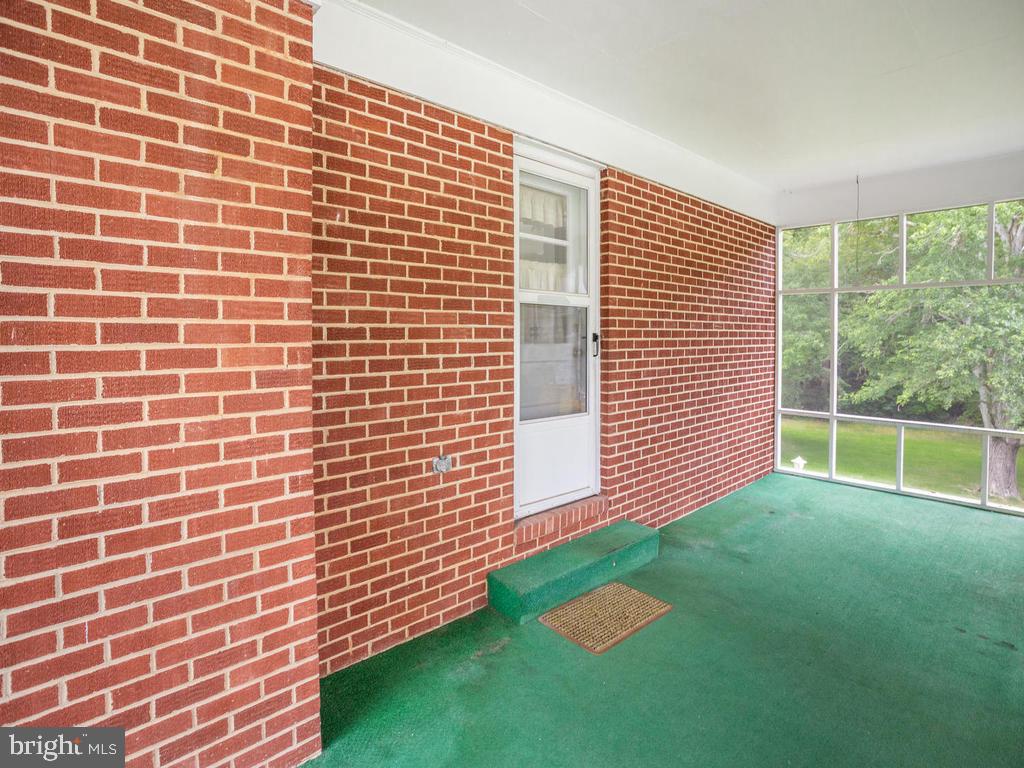 301 Plum Point Road Huntingtown, MD 20639 - Photo 4 of 17 Screened porch