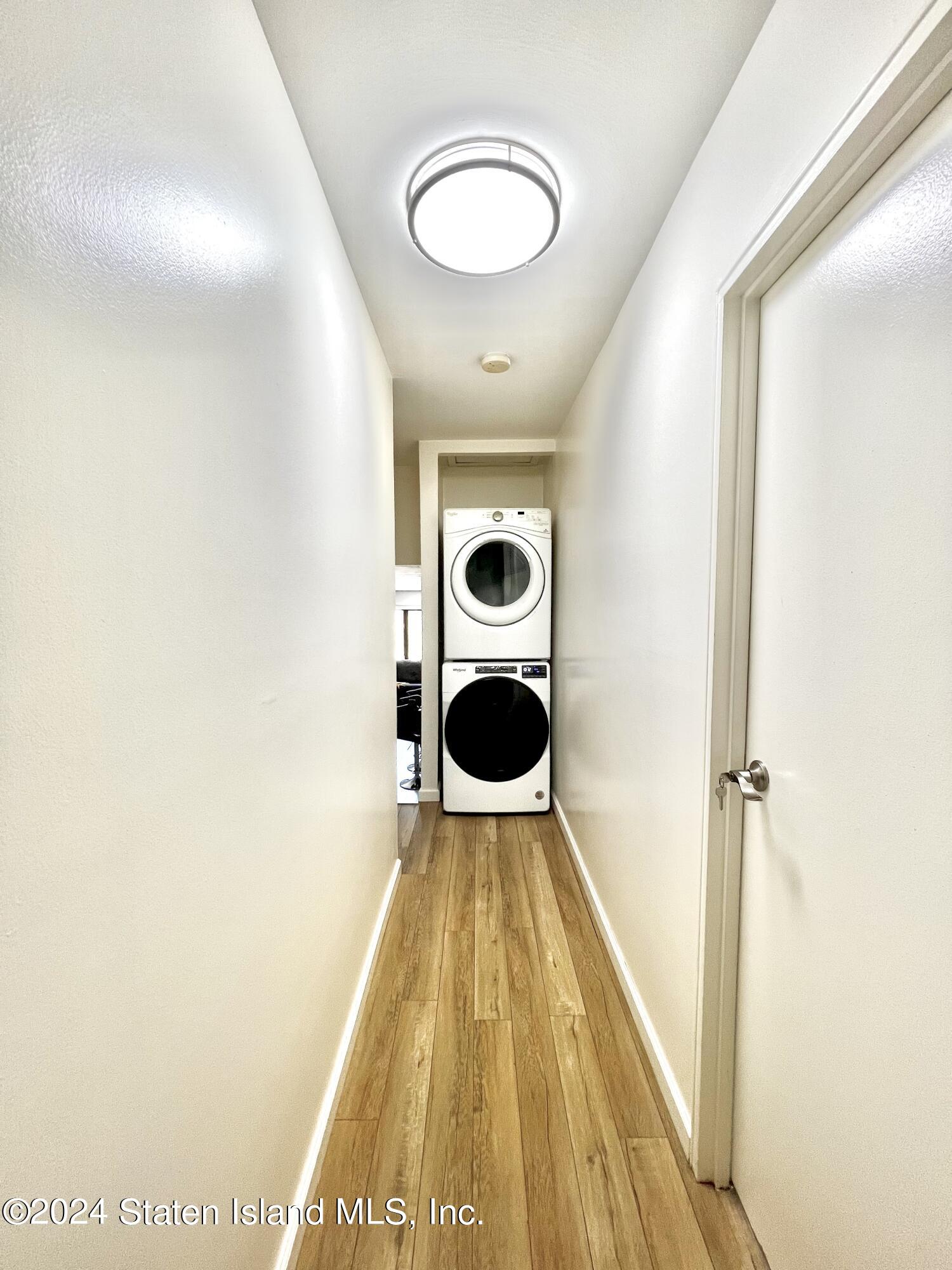 4 Futurity Place Staten Island, NY 10312 - Photo 15 of 26 a view of a hallway with wooden floor and closet