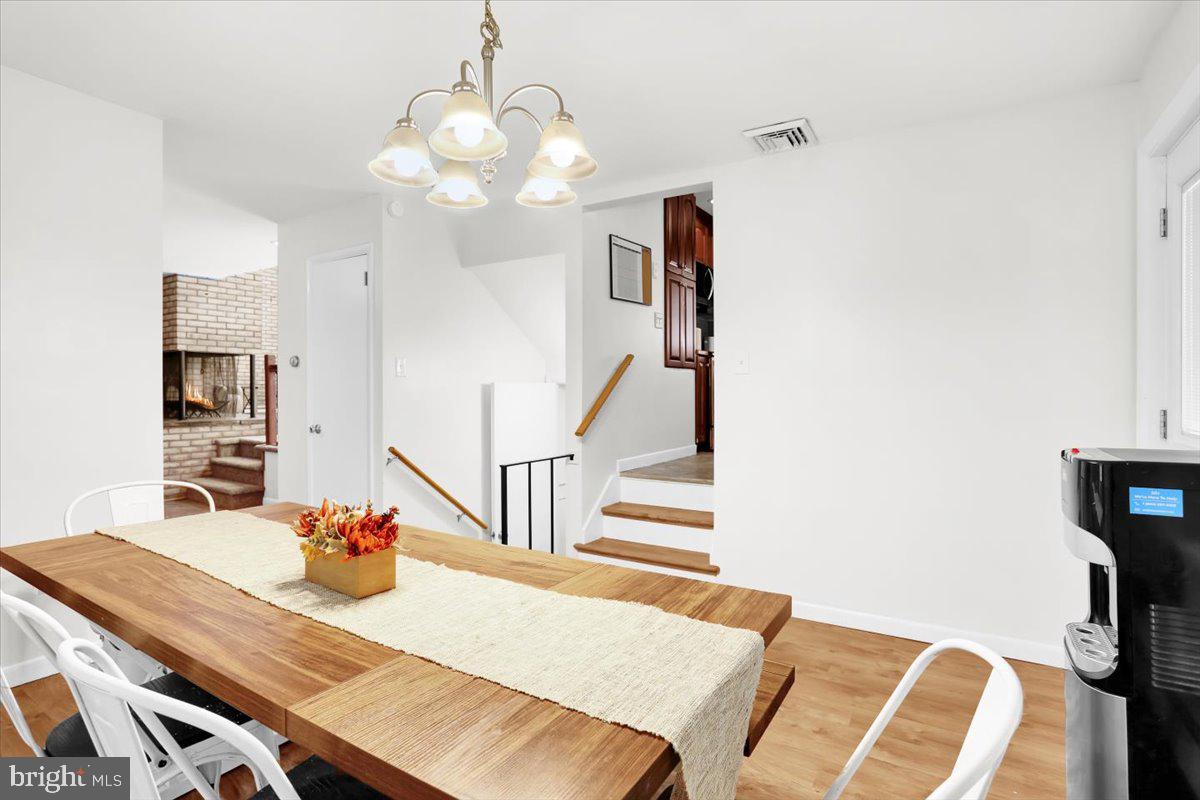 416 Green Lane Reading, PA 19601 - Photo 16 of 42 a view of a dining room with furniture and wooden floor
