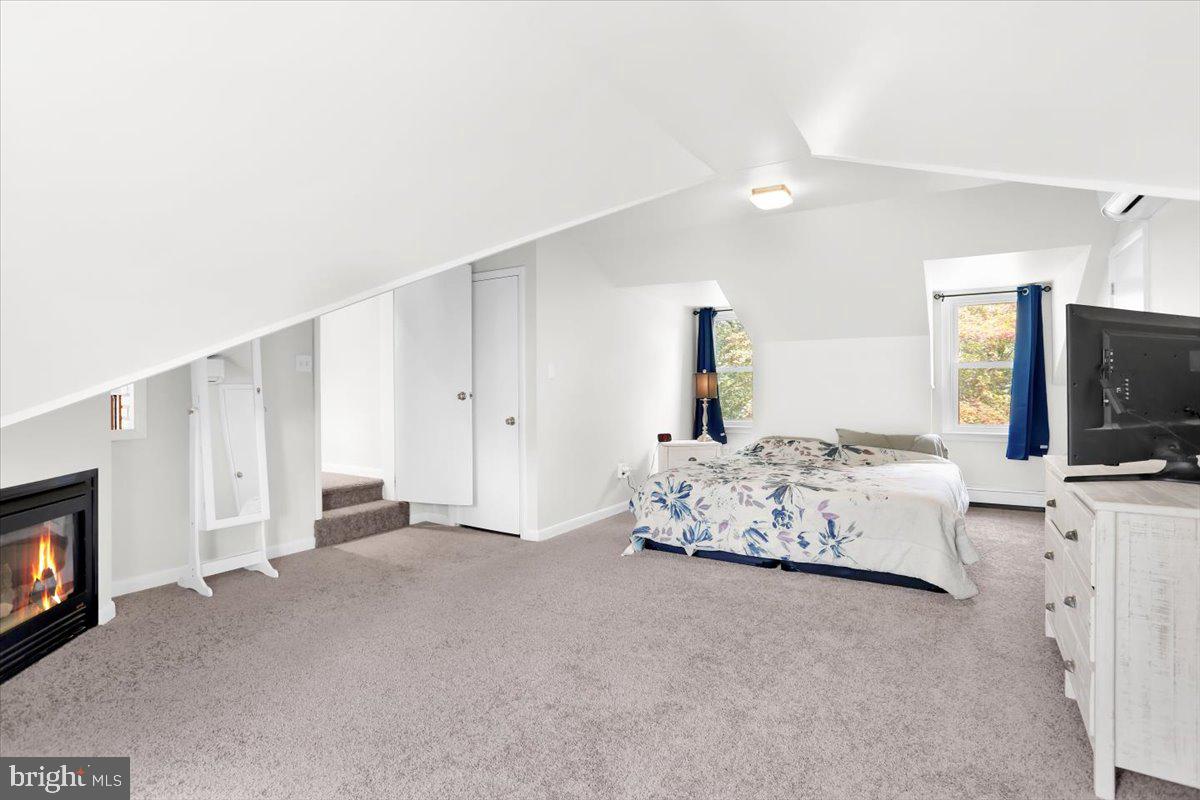 416 Green Lane Reading, PA 19601 - Photo 20 of 42 a spacious bedroom with a bed and a flat screen tv