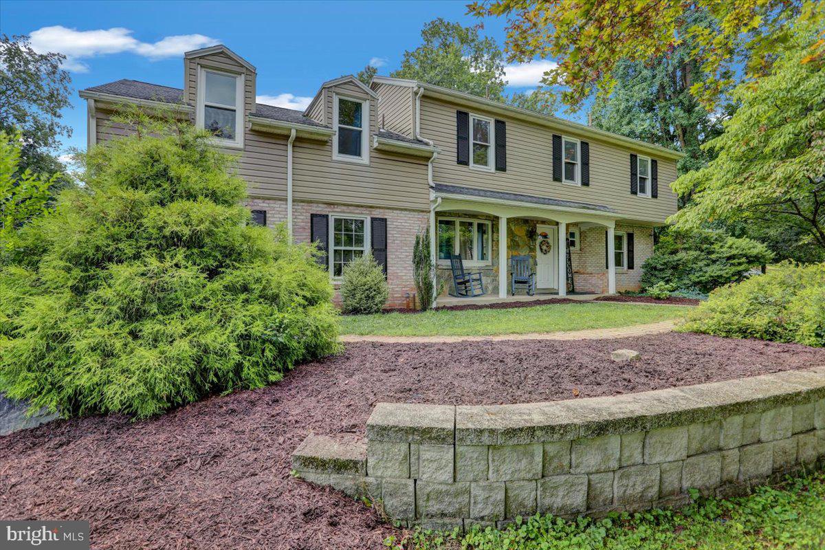 416 Green Lane Reading, PA 19601 - Photo 2 of 42 a front view of a house with garden