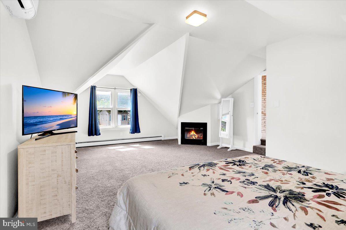 416 Green Lane Reading, PA 19601 - Photo 22 of 42 a view of a livingroom with wooden floor and a flat screen tv