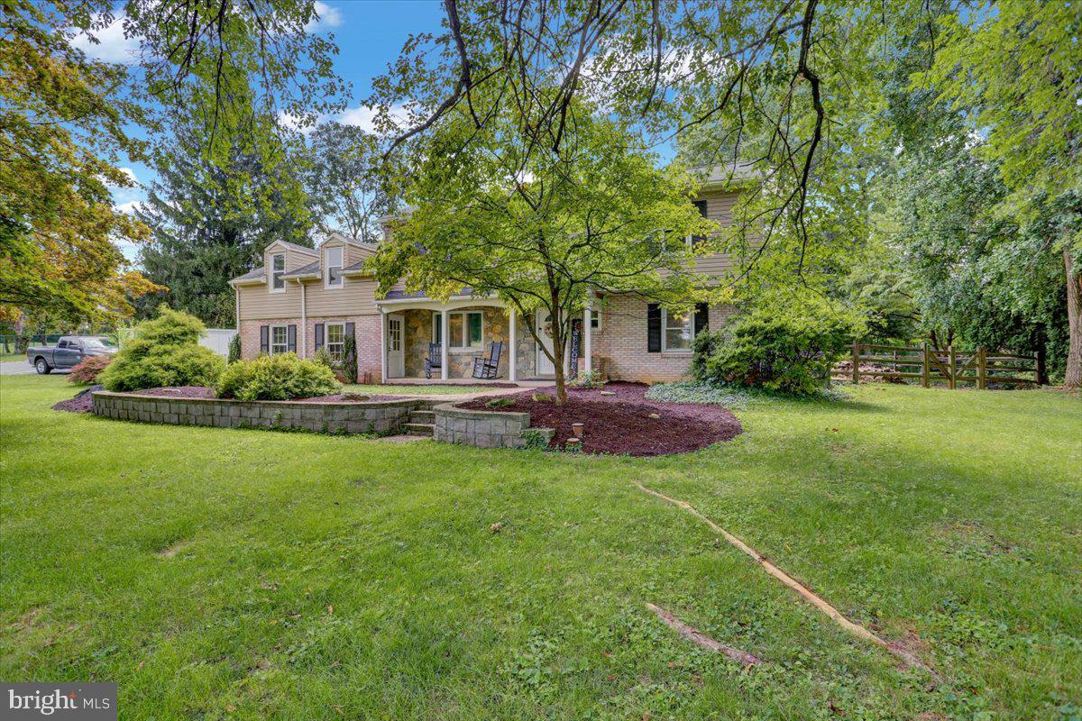 416 Green Lane Reading, PA 19601 - Photo 4 of 42 a front view of a house with a garden