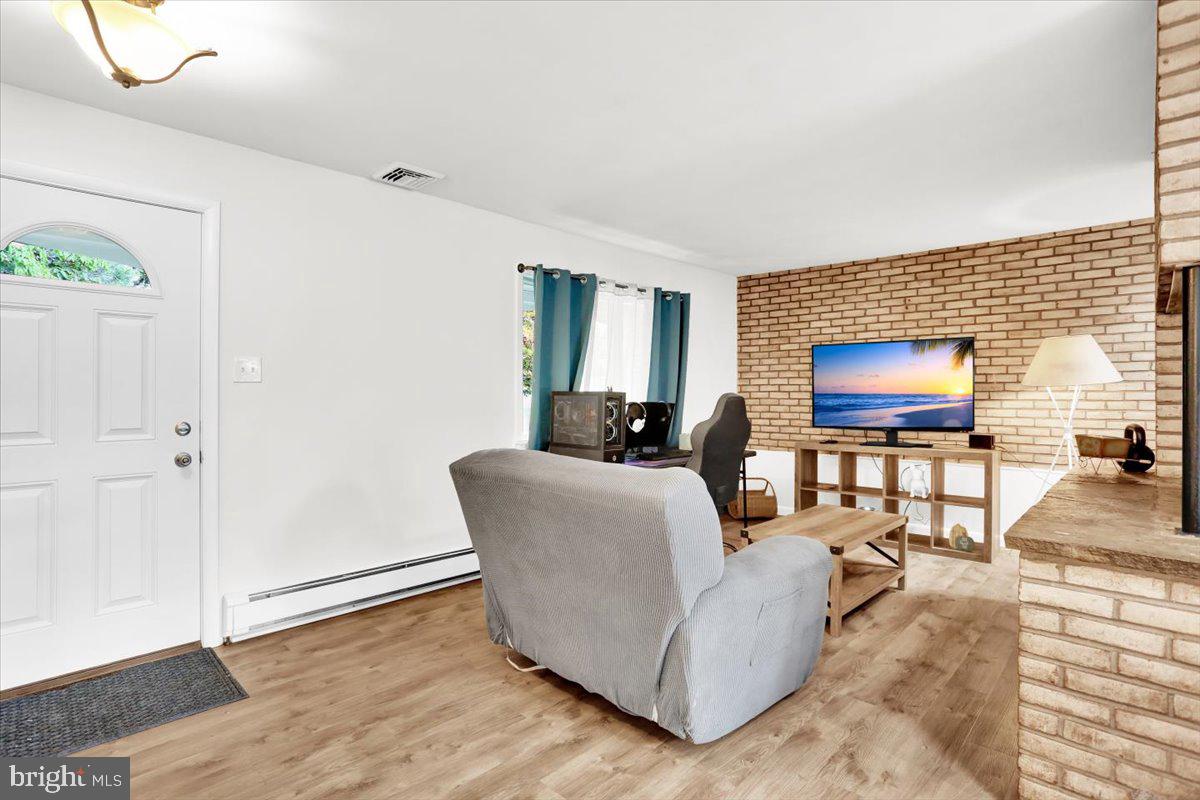 416 Green Lane Reading, PA 19601 - Photo 5 of 42 a living room with furniture and a flat screen tv