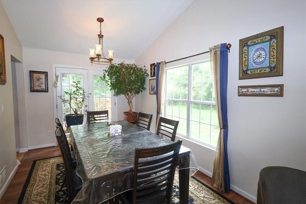 236 Hiram Sudie Road Dallas, GA 30157 - Photo 7 of 26 a view of a dining room with furniture window and wooden floor